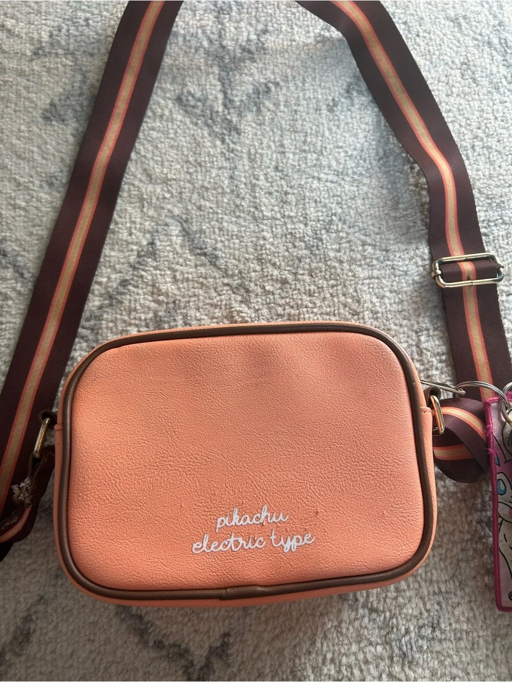Bioworld Peach Crossbody Bag with Brown Stripe Strap